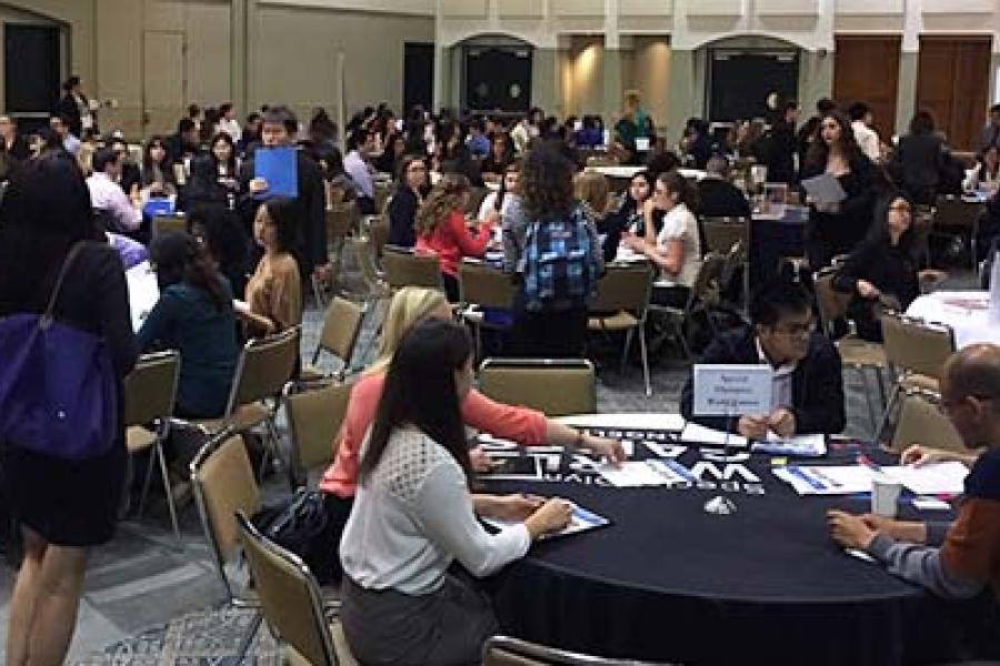 Large ballroom with students interviewing 