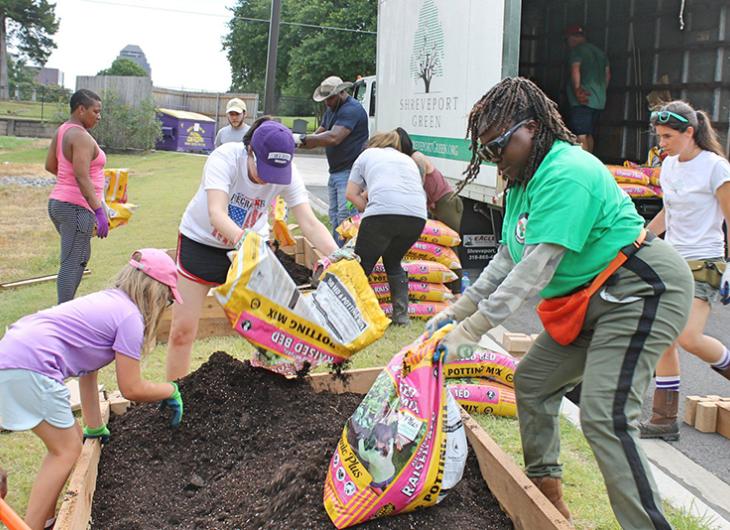 Volunteers making a box garden