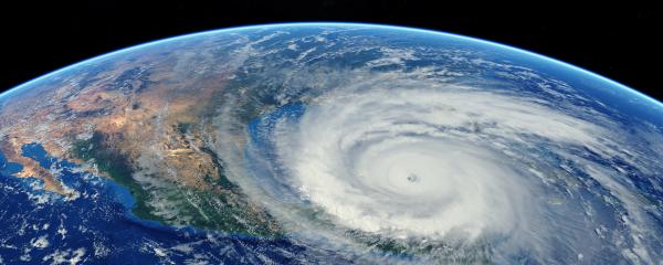 Hurricane approaching the American continent visible above the Earth, a view from the satellite. 