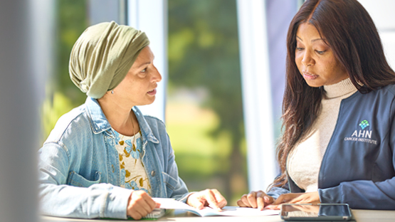 An AHN patient talking to her financial counselor.