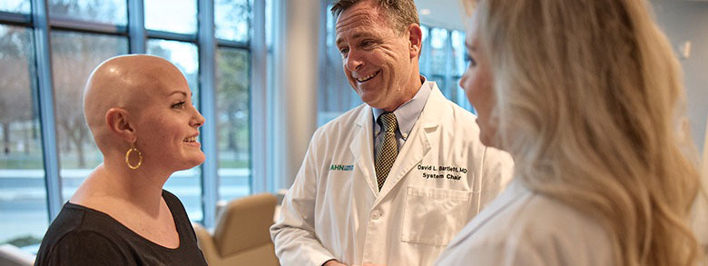 Two AHN cancer specialists talking to a patient.