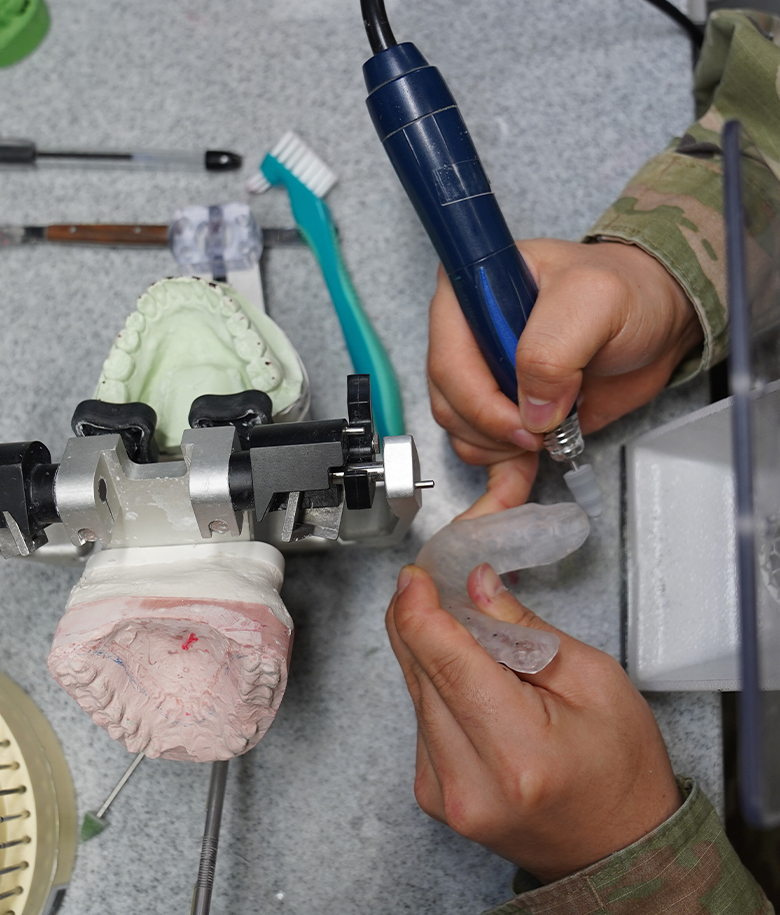 dental laboratory specialist working on a prostheses