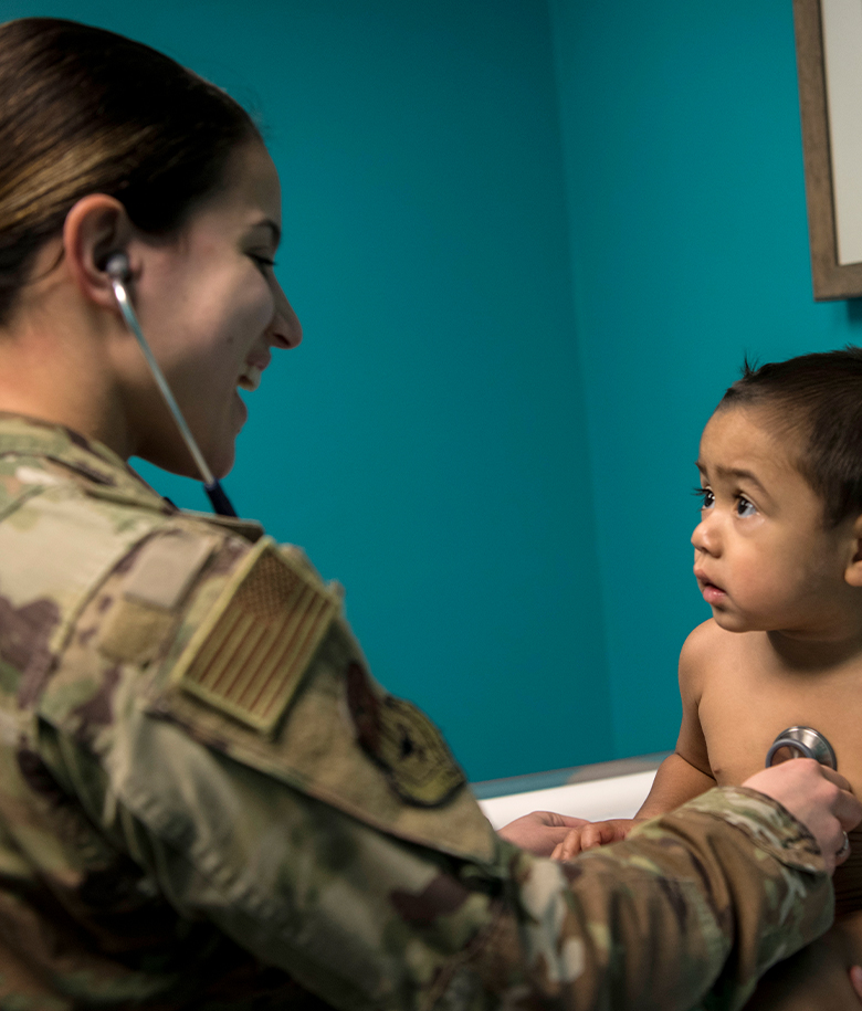 pediatrician listening to a toddler's heart