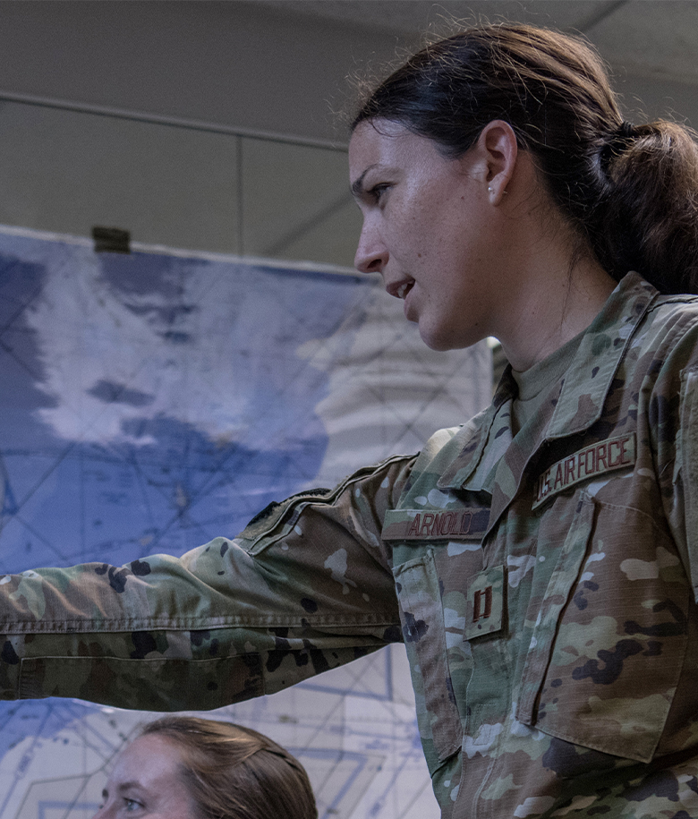 woman pointing at data on a screen