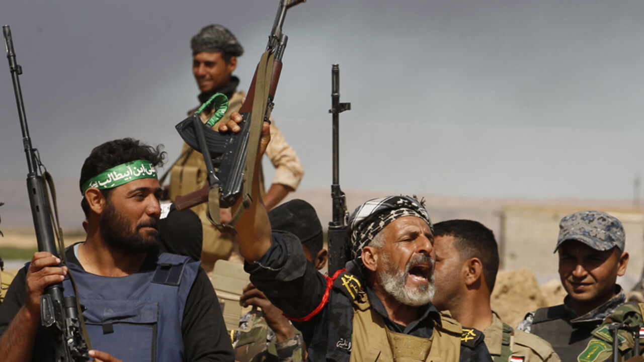 Shi'ite fighters chant slogans as they advance into the town of Tal Ksaiba, near the town of al-Alam, March 7, 2015. REUTERS/Thaier Al-Sudani (IRAQ - Tags: POLITICS CIVIL UNREST CONFLICT)



Thaier Al-Sudani: "It was me and a few other Iraqi journalists working for local outlets. We went to the frontlines in coordination with the Iraqi government forces and supporting militias.
 
The press officer would come in the morning and take us to the frontline in a convoy.
 
Whenever an area was won from Islamic Sta