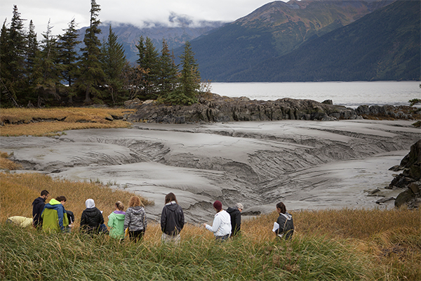 A class walks along Turnagin Arm on a field trip