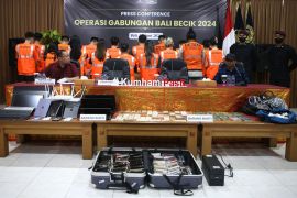 Detained Taiwanese line up at a detention center in Jimbaran, Bali, Indonesia