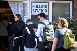People queue to vote at a polling station during the general election in London [Claudia Greco/Reuters]