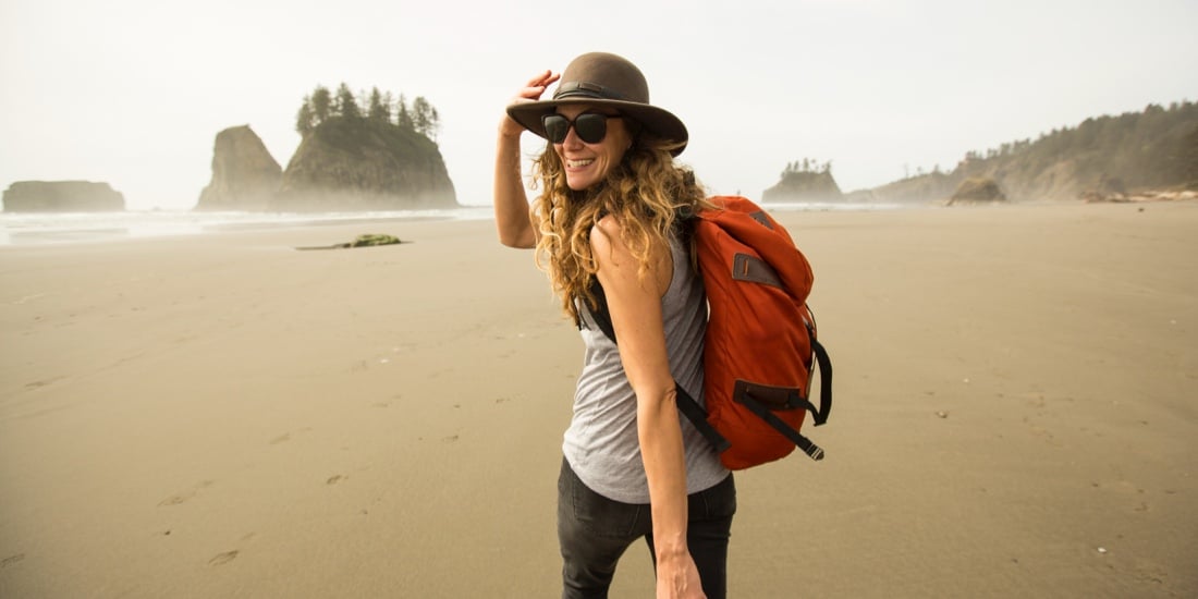 Woman walking out onto the sand