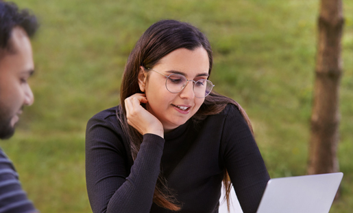 Federica and a coworker collaborating outside.