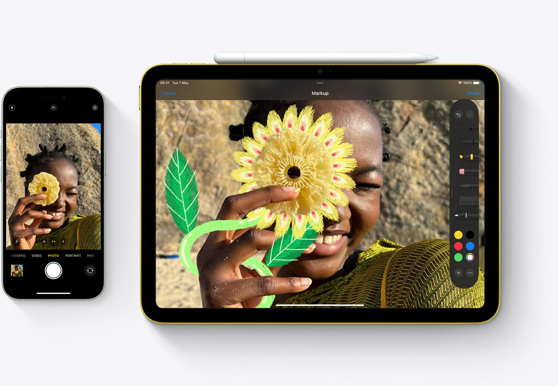 An iPhone 15 and iPad side by side highlighting how a photo taken with the camera on iPhone can be marked up in the Photos app on iPad.