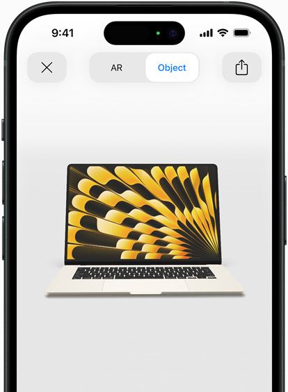 Preview of MacBook Air in Starlight color being viewed in AR experience on iPhone