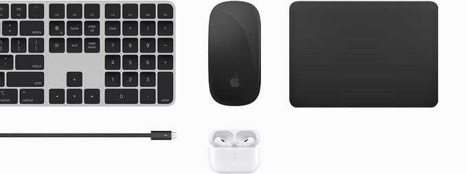 Een verzameling accessoires, waaronder Magic Keyboard, Magic Mouse, Magic Trackpad, Thunderbolt 4 Pro-kabel en AirPods Pro.