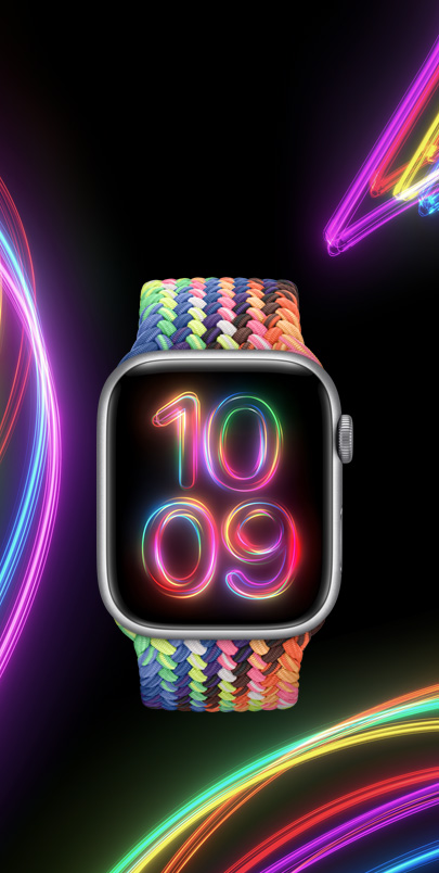 Eine Apple Watch Series 9 mit dem neuen Geflochtenen Solo Loop Pride Edition in mehreren Neonfarben und das passende Pride Radiance Zifferblatt.