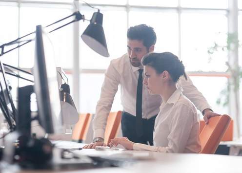 Two people working together in an office