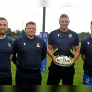 Andy Duncan (middle right) alongside some of the club's background team.