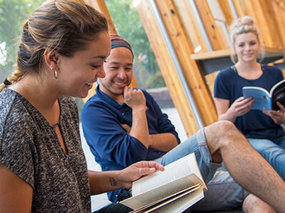 Students sitting and reading books at the SALT Center