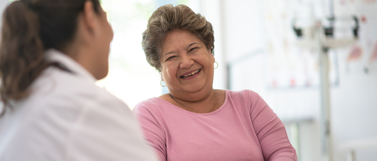 2 women talking and laughing