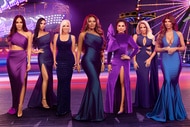 The cast of the Real Housewives of New Jersey in front of a carnival backdrop.