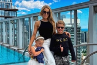 Lisa Hochstein of The Real Housewives of Miami poses with her children on a high rise on Instagram.