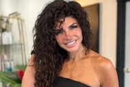 Teresa Giudice smiling inside of a hair salon.