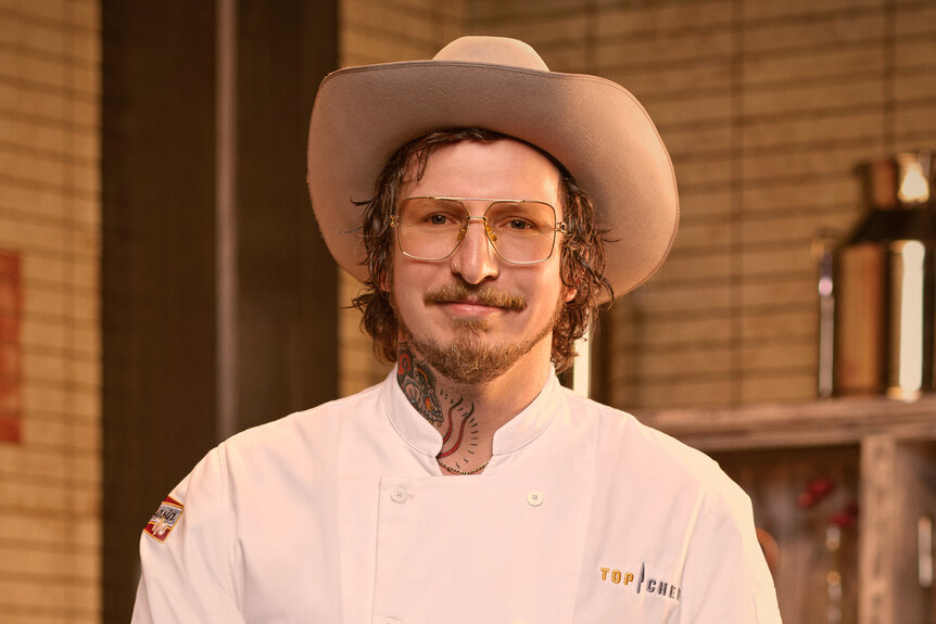 David Murphy wearing a chef's uniform in a kitchen pantry