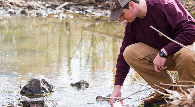 Student checking water quality