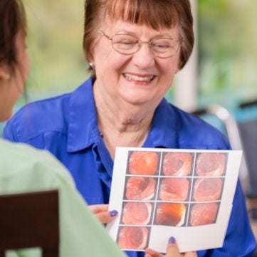 middle aged woman and her mother discuss colonoscopy results with nurse