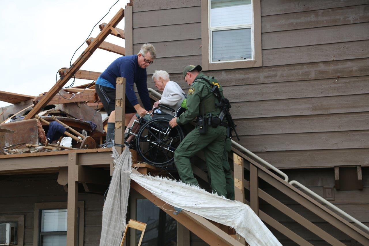 Rio Grande Valley Sector Border Patrol Special Operations Agents assist a disaster survivor trapped on the second floor of his home in Rockport, Texas August 26, 2017. Photo courtesy of U.S. Customs and Border Protection.