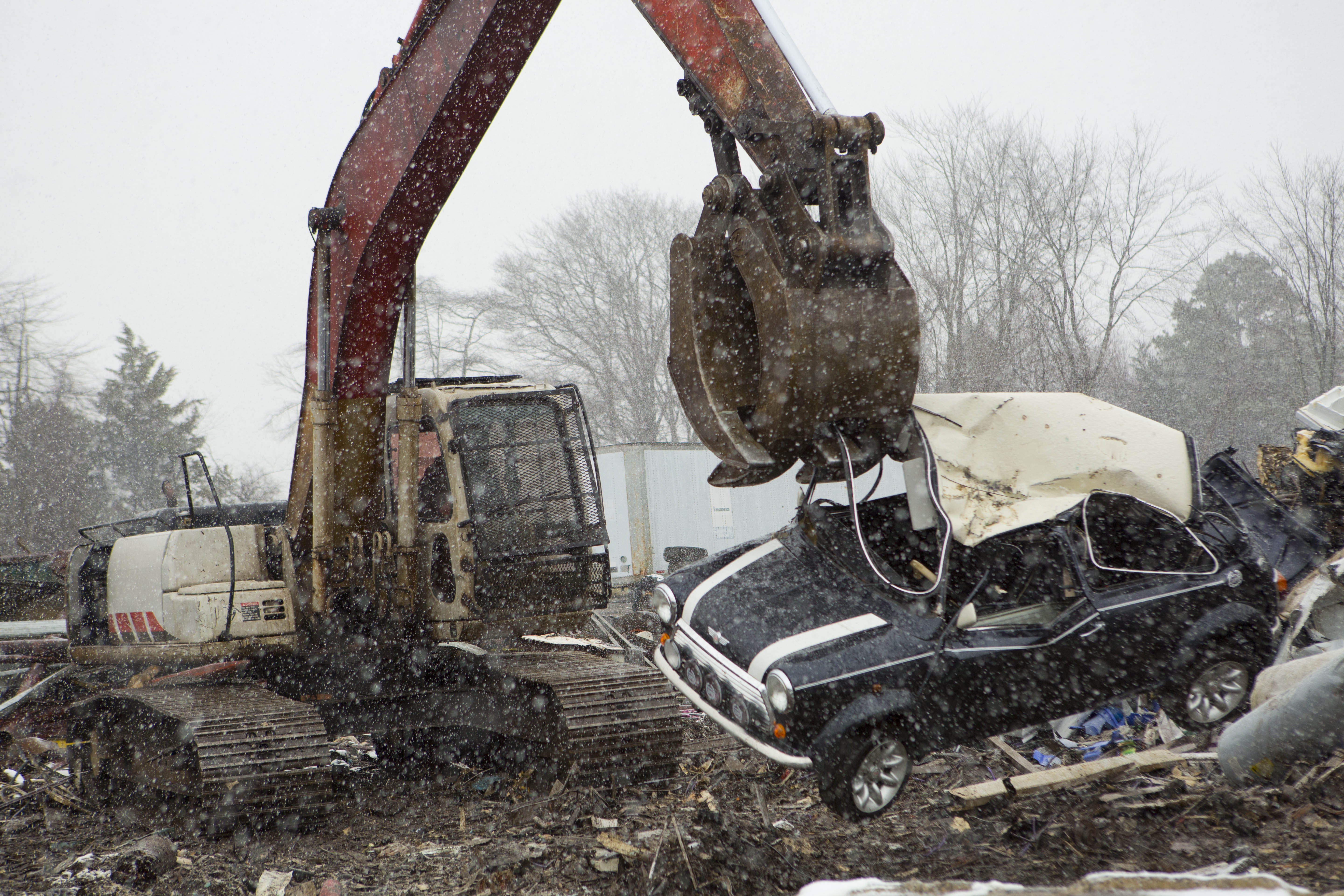 U.S. Customs and Border Protection in conjunction with British Authorities destroy a Mini Cooper that had many violations related to importation. Photo Credit: James Tourtellotte.