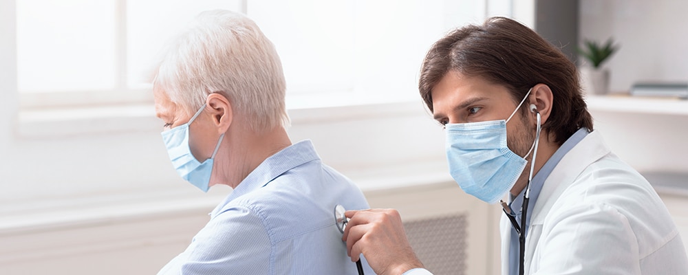 girl with doctor and parent