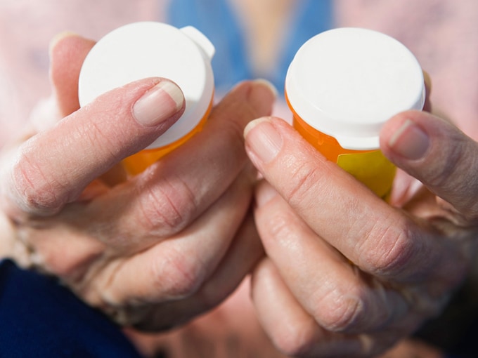 View of a senior woman holding medicines