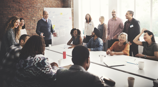 Charity employees in conference room