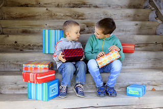 boys playing with gifts