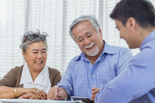 elderly couple in a meeting