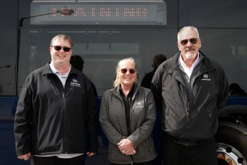 Metro Transit operators smiling in front of bus 