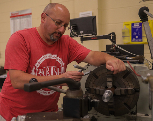 Student working on a grinder