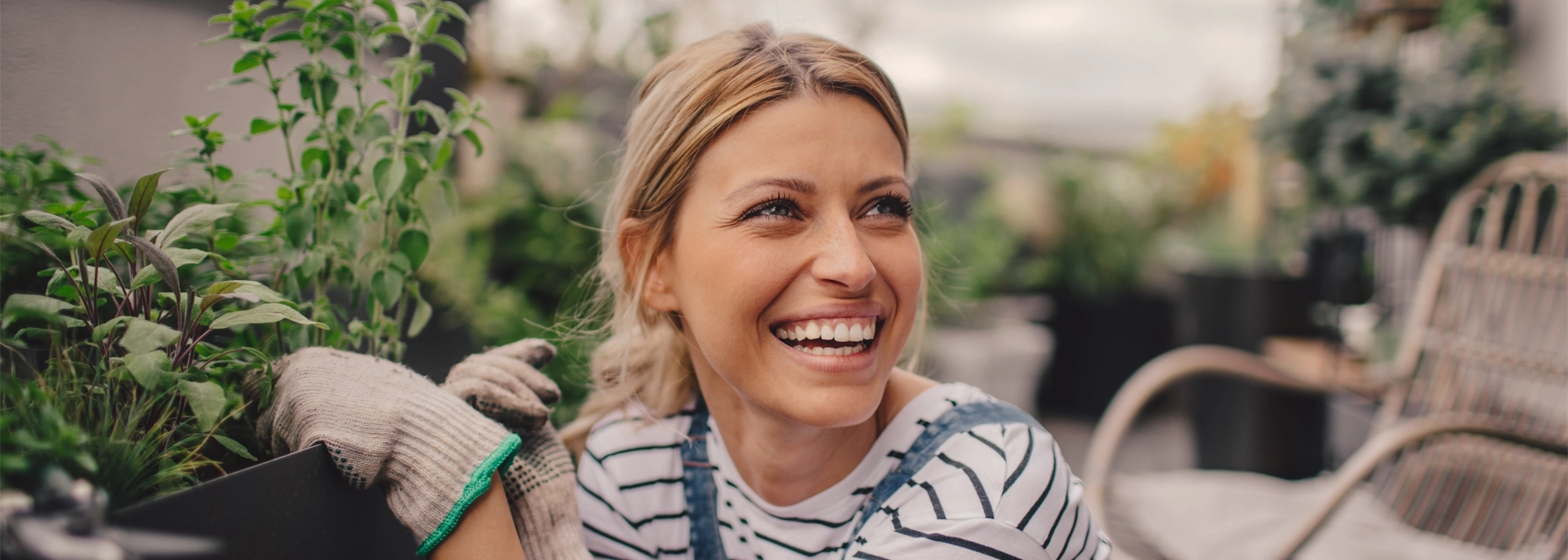 woman-smiling-and-gardening-2000x714.webp