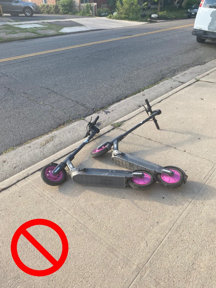 An example of incorrect parking - don’t leave scooter on its side or too close to the curb