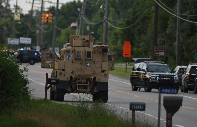 Police were assembled along Hamlin Road near Dequindre Road in Shelby Township on the evening of Saturday, July 15, 2024 after a shooting at the Brooklands Plaza Splash Pad in neighboring Rochester Hills, Michigan on June 15, 2024.