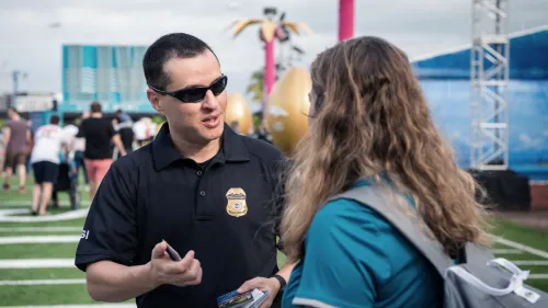 Homeland Security Investigations agent talking to a student