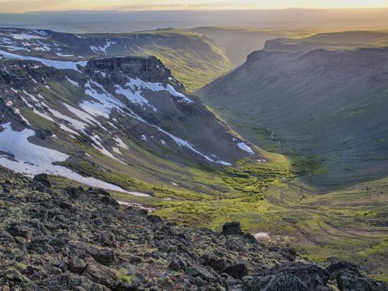 Light snow covers the Steens Mountains in soft light. 