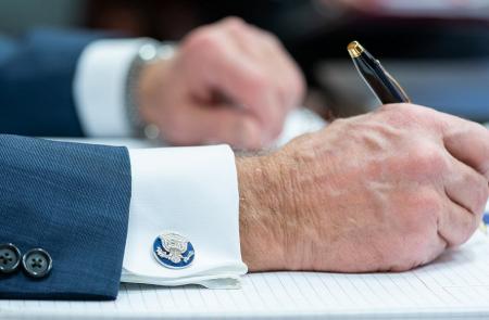 President Joe Biden signs a document