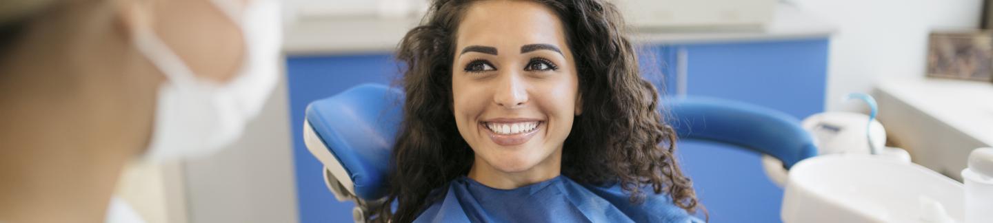 Women Talking To Dentist