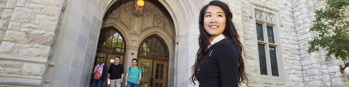 Smiling female student looking ahead