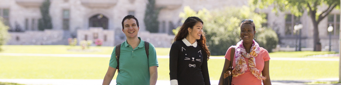 Five students walking and having a discussion