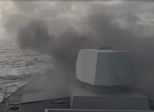 Rear view of a naval gun firing .