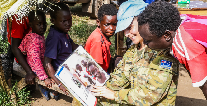 Female UN Peacekeeper with children