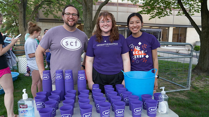 SCF Club members at table with blue cups