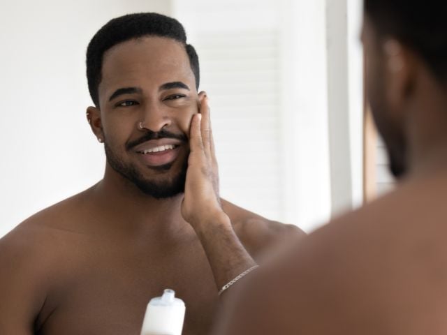 Man applying cosmetics